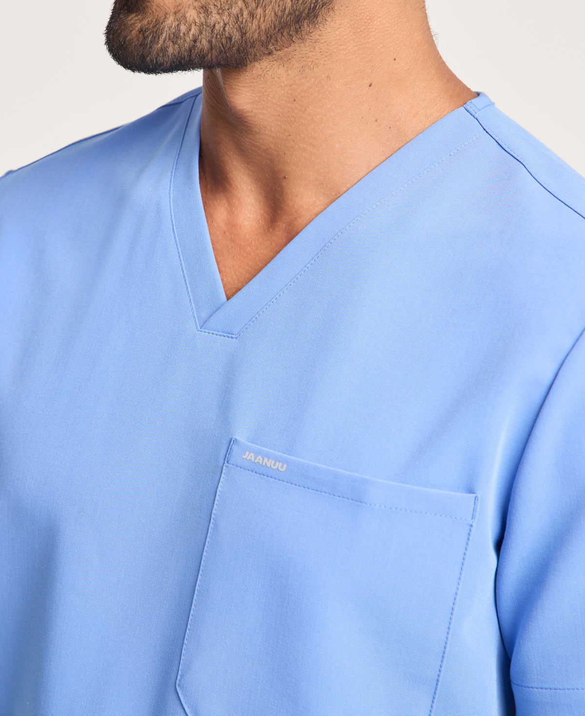 Jaanuu Holmes 1-Pocket Scrub Top in Ceil Blue, product photo 2 of 6