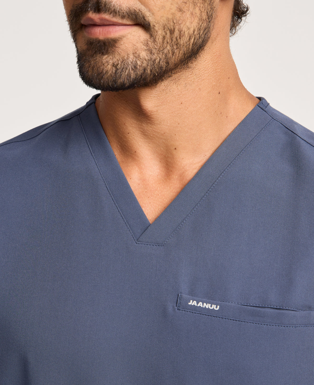 Jaanuu Platt 3-Pocket Scrub Top in Carbon Gray, product photo 2 of 6