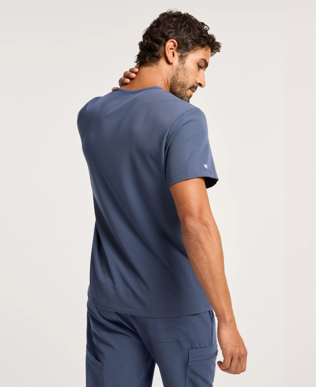 Jaanuu Platt 3-Pocket Scrub Top in Carbon Gray, product photo 6 of 6