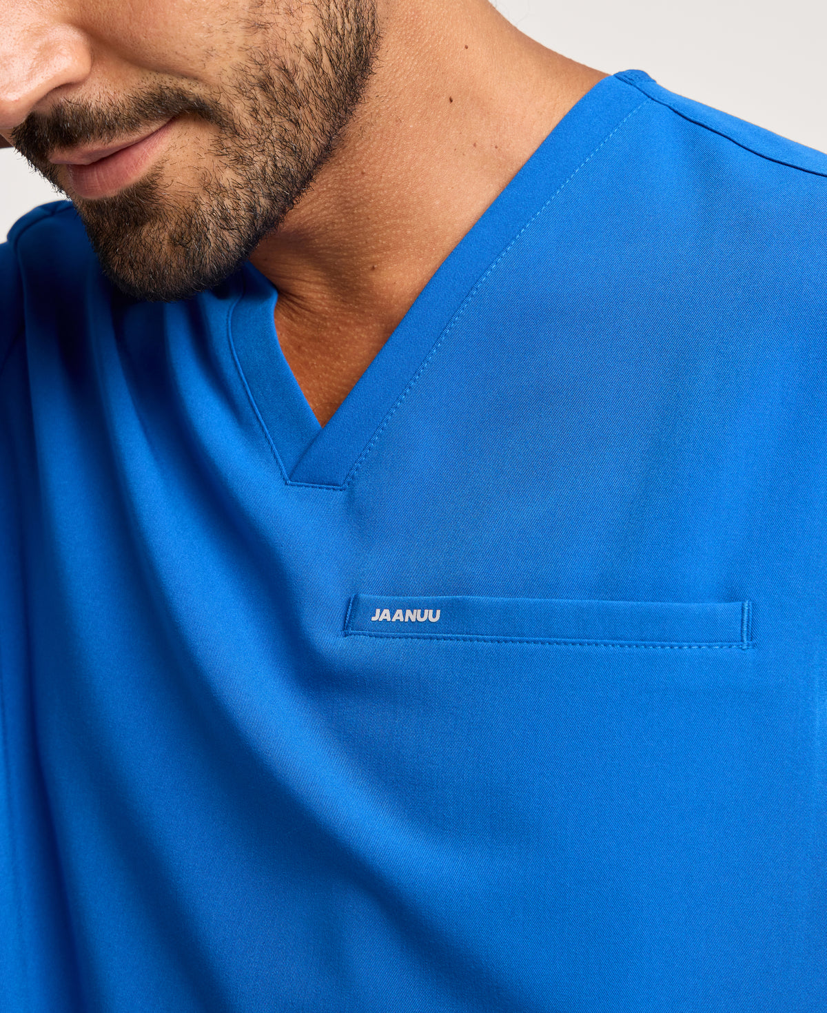 Jaanuu Platt 3-Pocket Scrub Top in Royal Blue, product photo 2 of 6