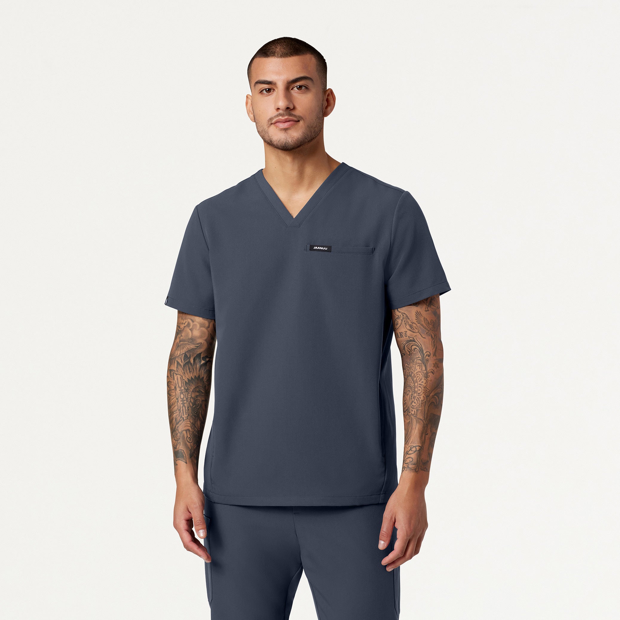 Man wearing Carbon Gray scrub top