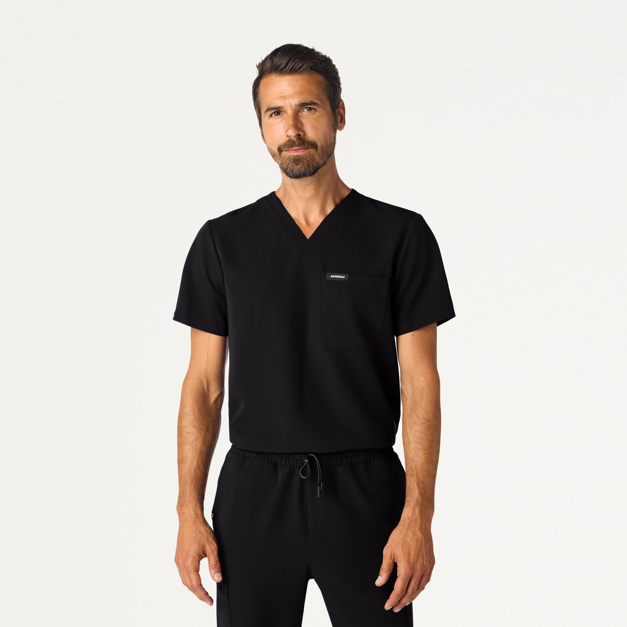 Man wearing Black scrub top.