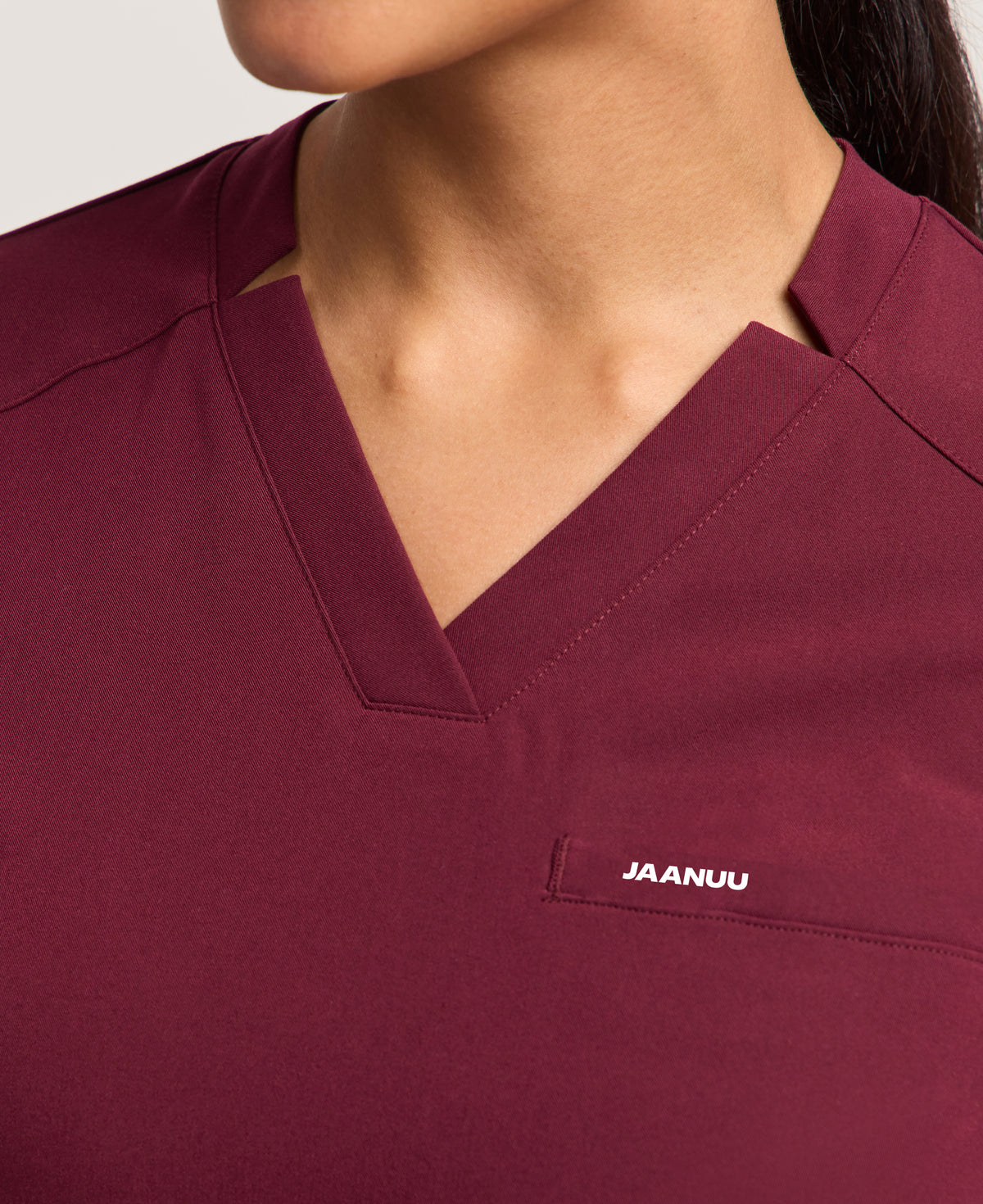 Jaanuu Helia Slim Notched V-Neck Scrub Top in Burgundy, product photo 2 of 6