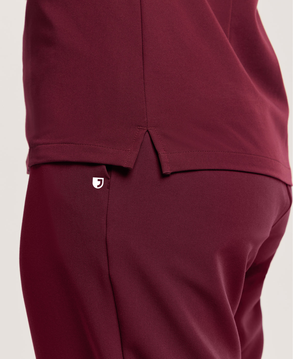 Jaanuu Helia Slim Notched V-Neck Scrub Top in Burgundy, product photo 6 of 6