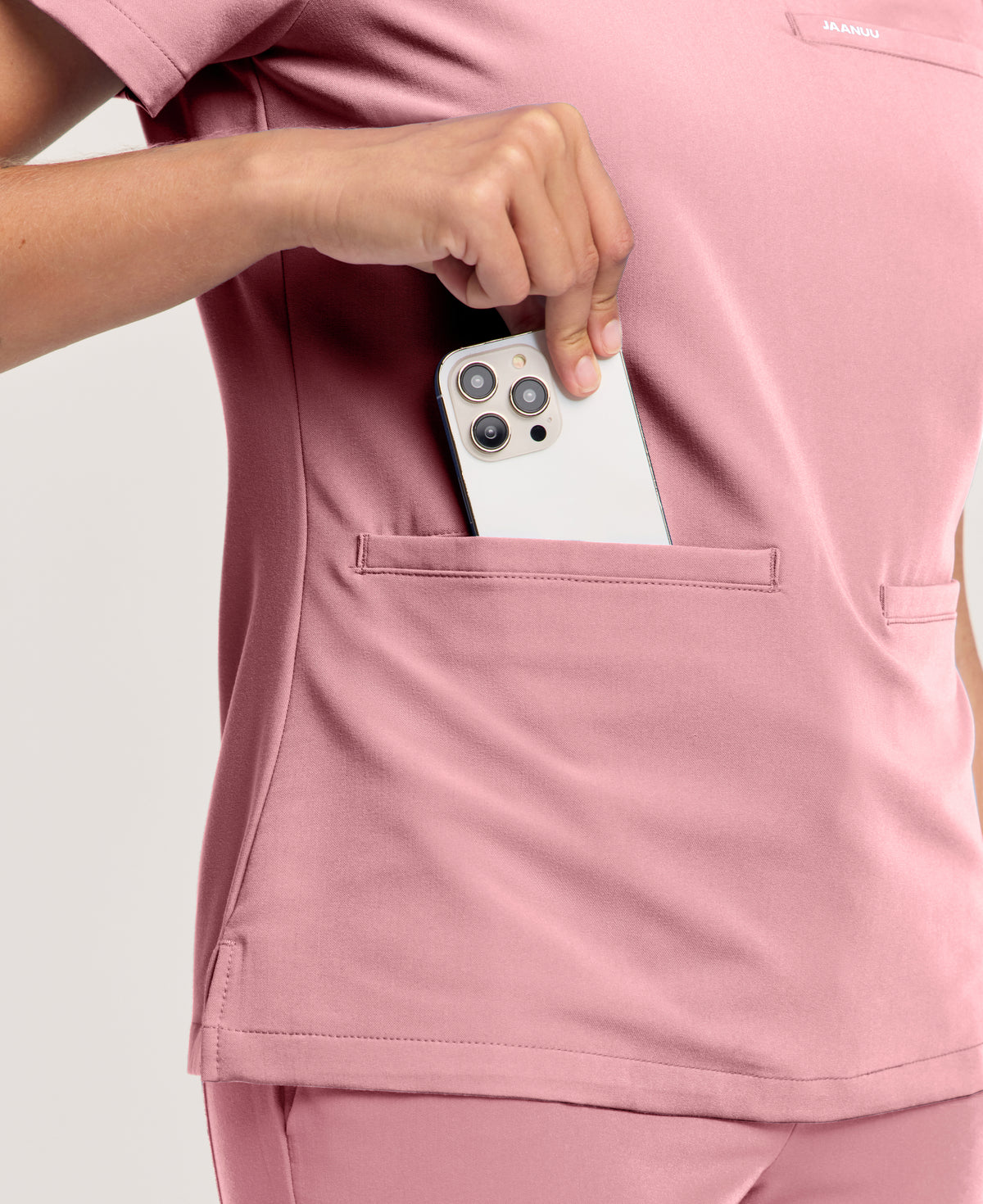 Jaanuu Helia Slim Notched V-Neck Scrub Top in Mauve, product photo 6 of 6