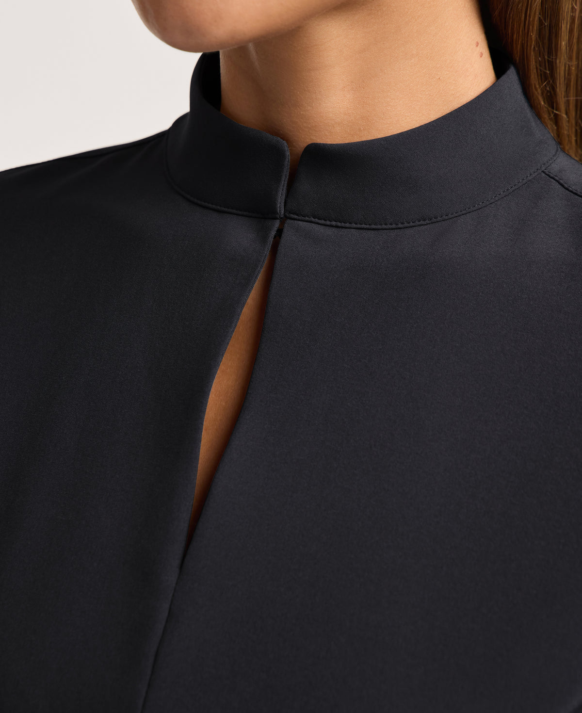 Jaanuu Alex Mock-Neck Scrub Top in Black, product photo 2 of 6