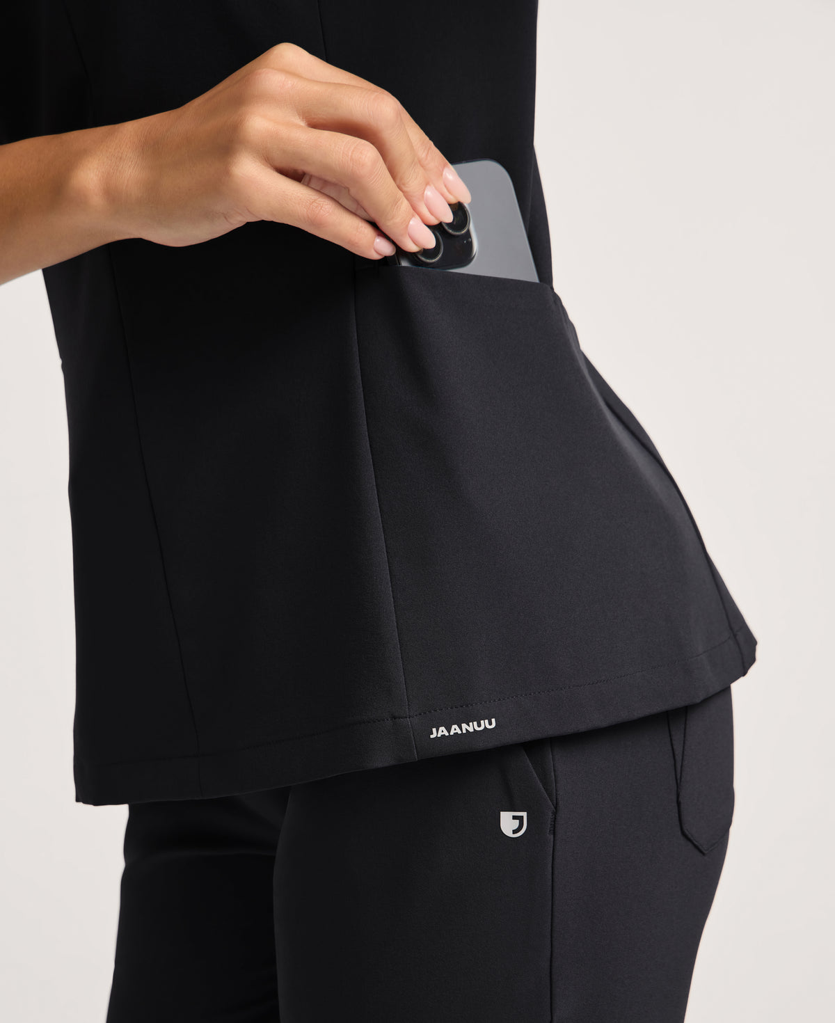 Jaanuu Alex Mock-Neck Scrub Top in Black, product photo 6 of 6