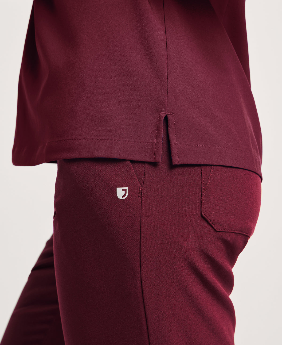 Jaanuu Harlow Slim 1-Pocket Scrub Top in Burgundy, product photo 6 of 6
