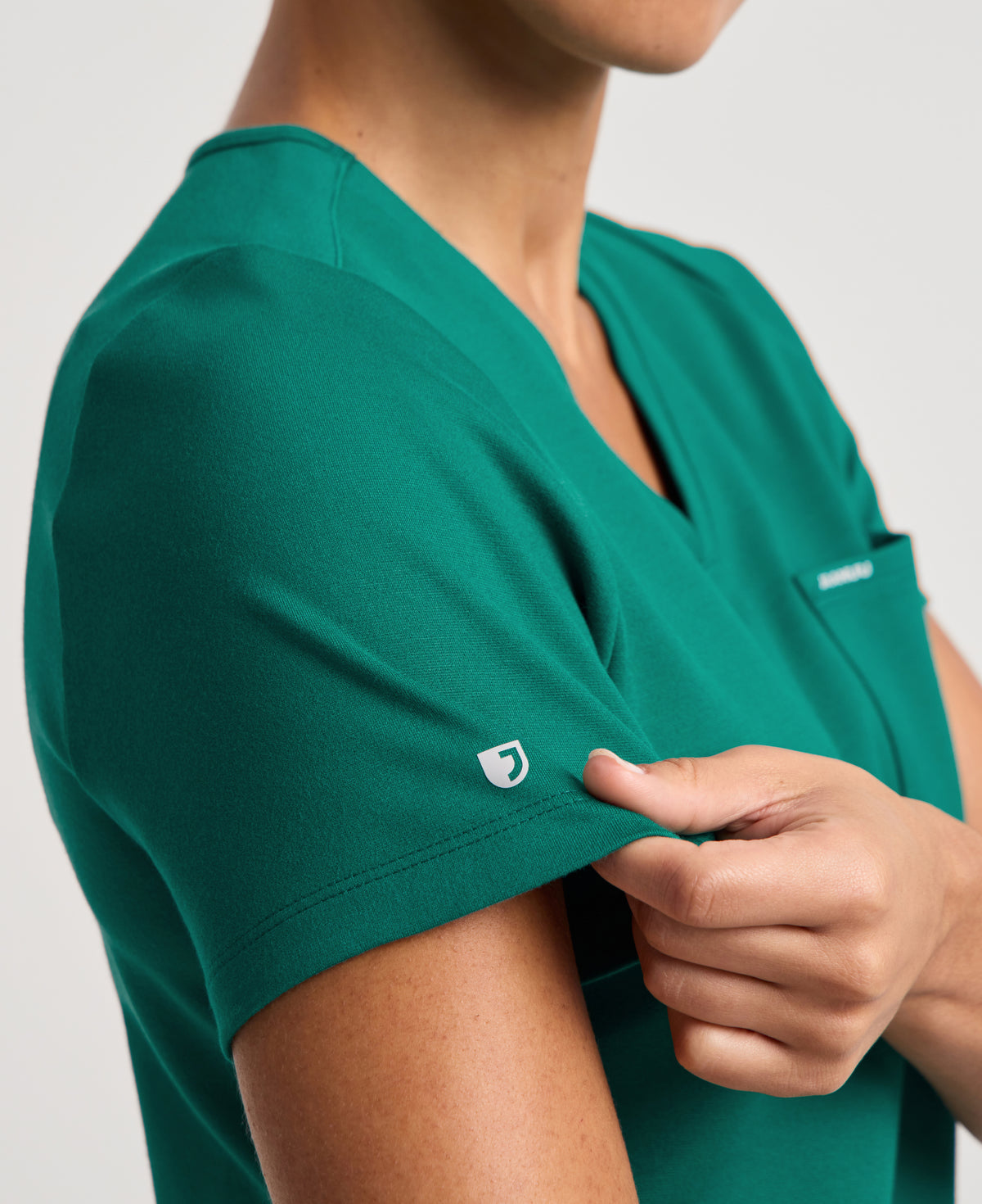 Jaanuu Keva Slim 1-Pocket Scrub Top in Hunter Green, product photo 6 of 6