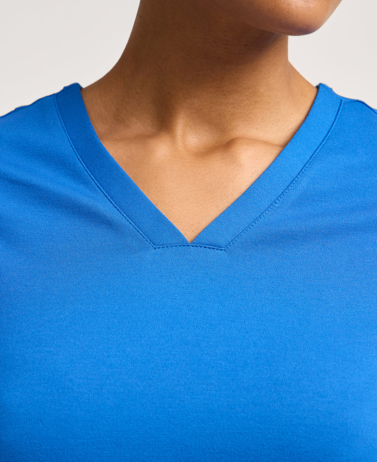 Jaanuu Kass Slim 4-Pocket Scrub Top in Royal Blue, product photo 2 of 6