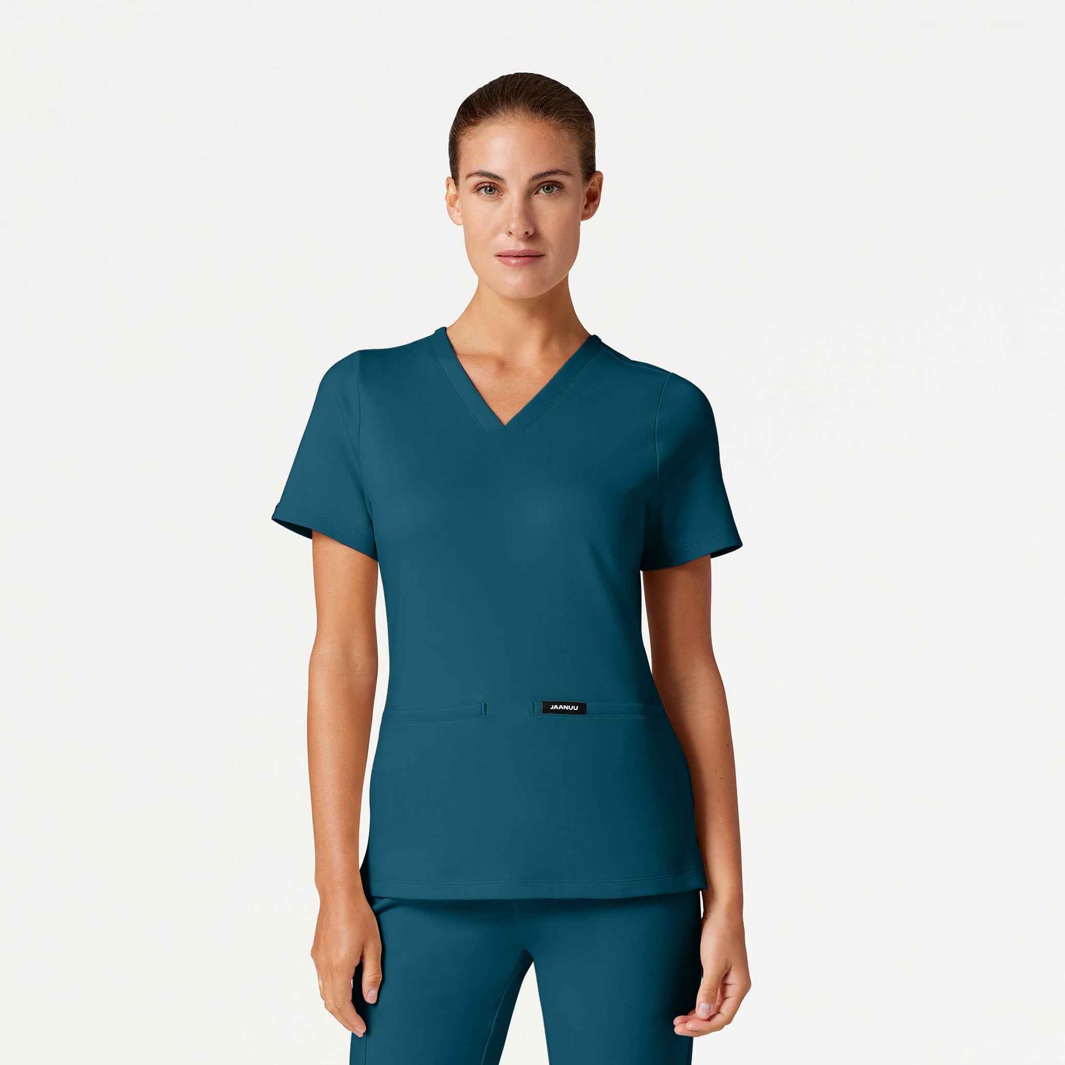 Woman wearing Caribbean Blue scrubs