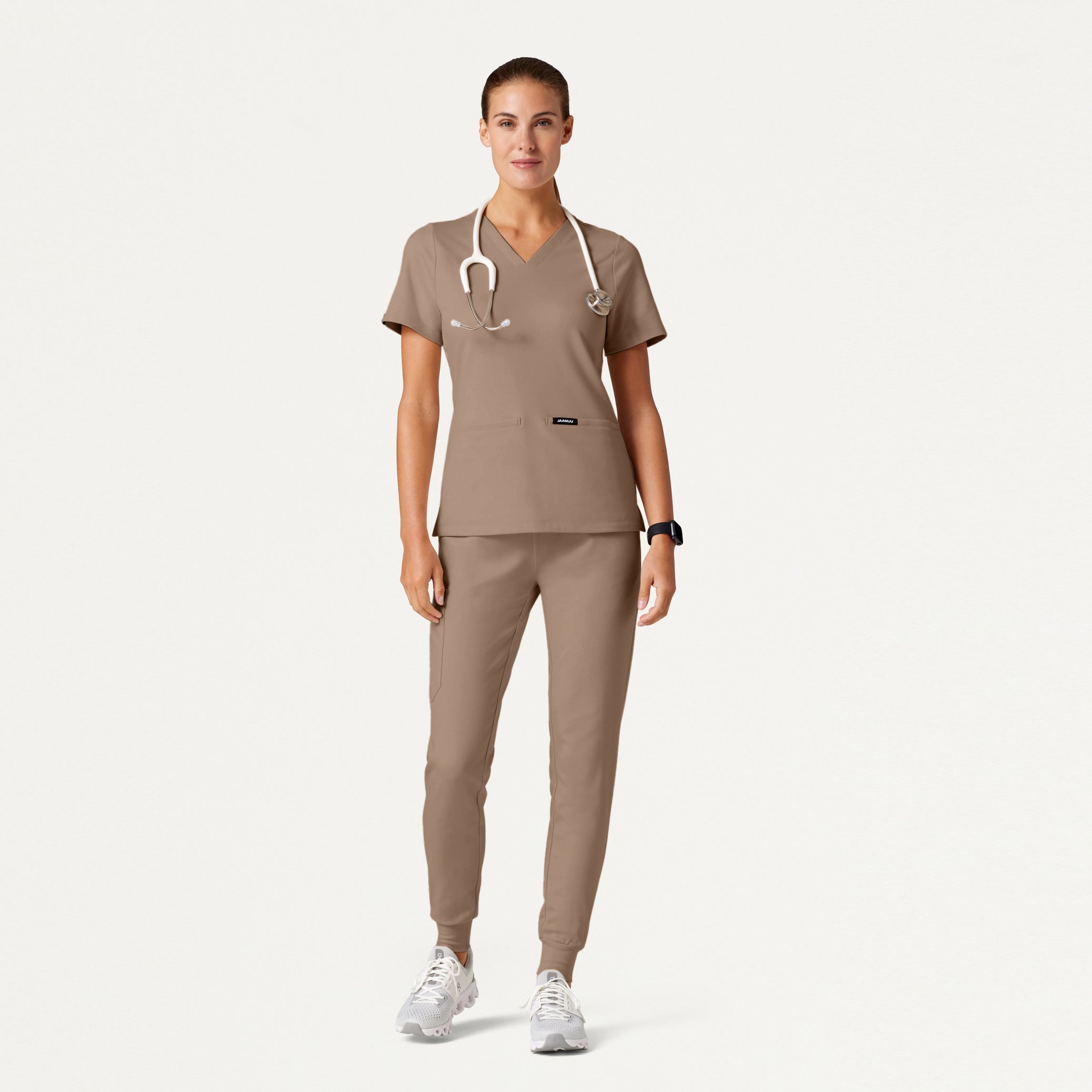 Woman wearing a Mocha scrub set