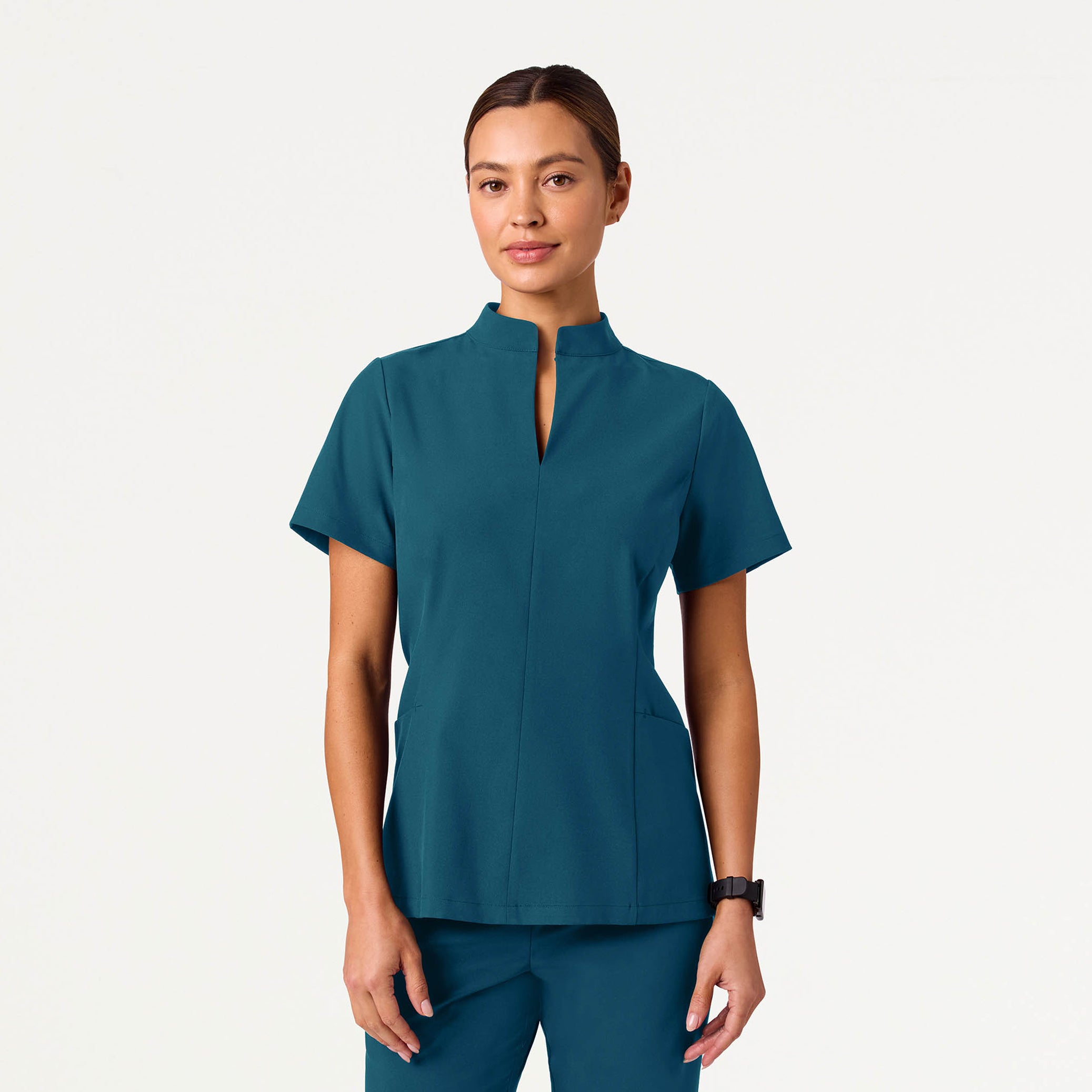 Woman wearing Caribbean Blue scrubs