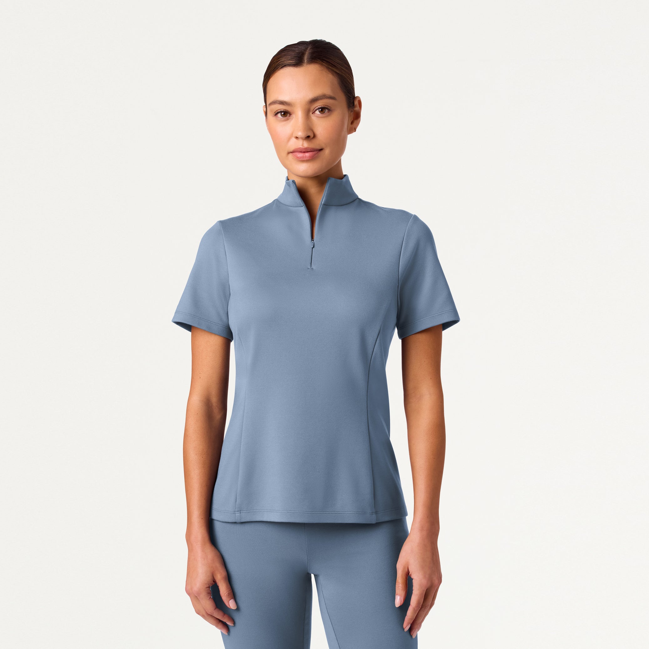 Woman wearing Storm Blue scrub top