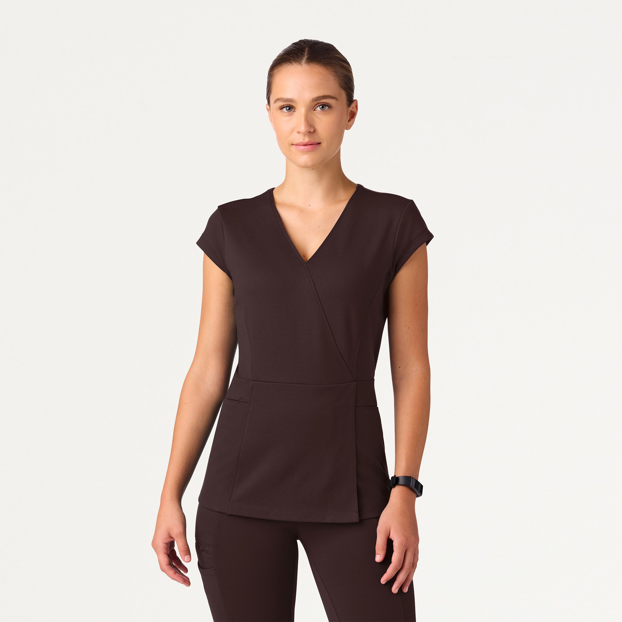 Woman wearing an Espresso scrub top