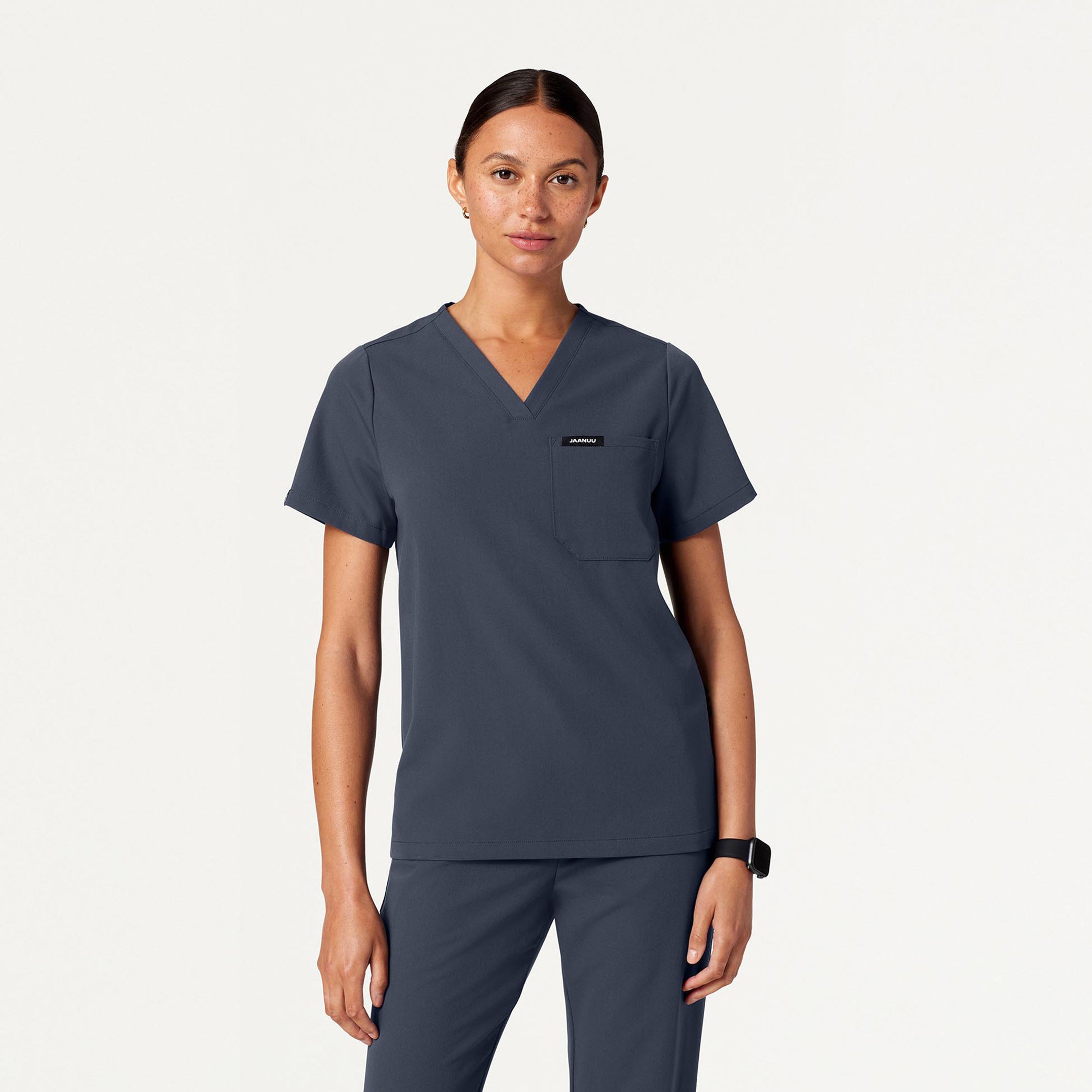 Woman wearing Carbon Gray scrubs