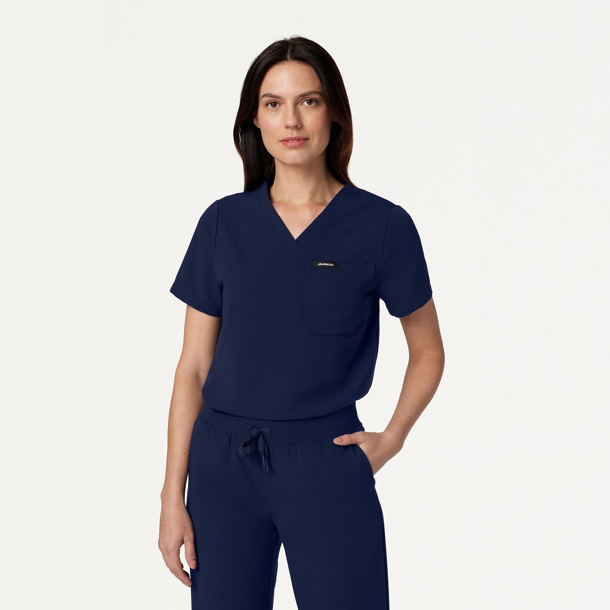 Woman wearing Midnight Navy scrubs