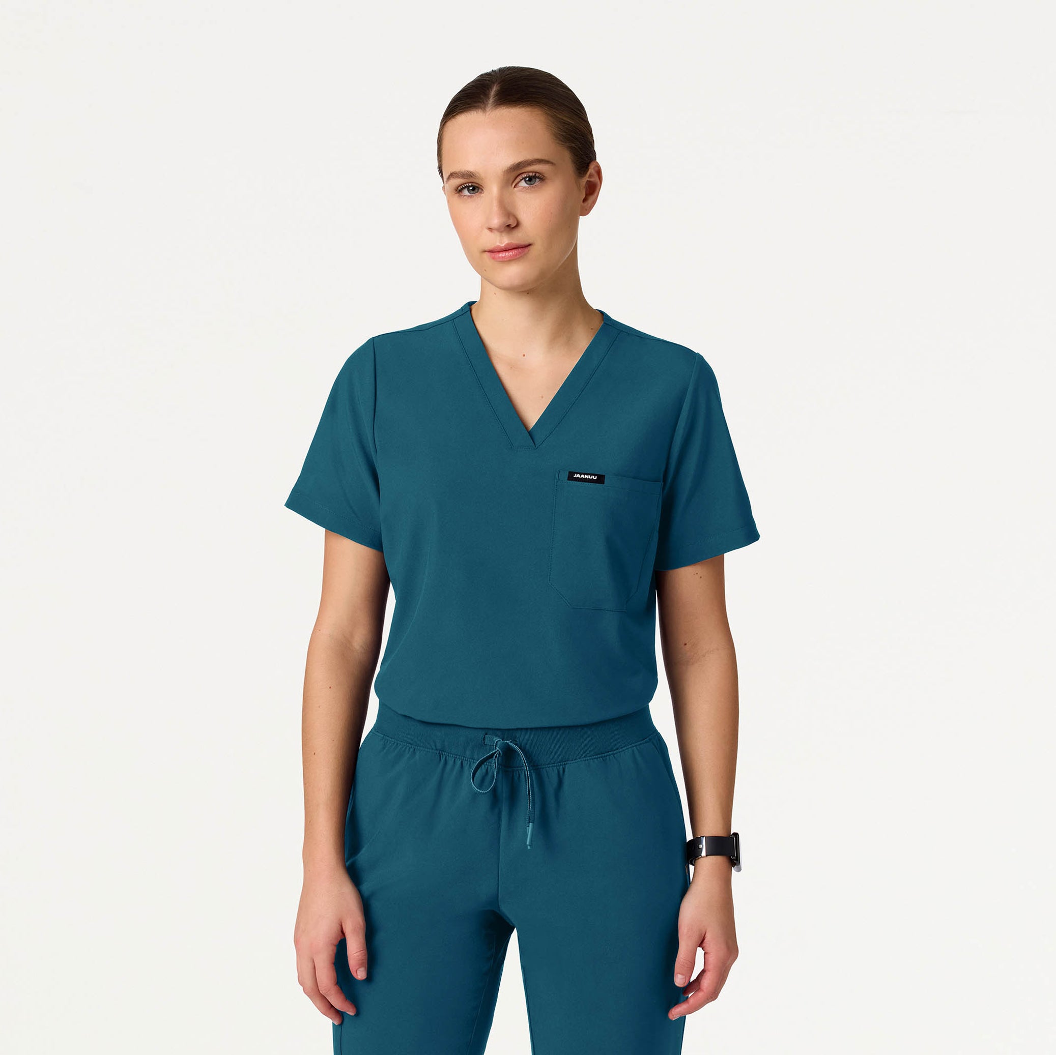 Woman wearing Caribbean Blue scrubs