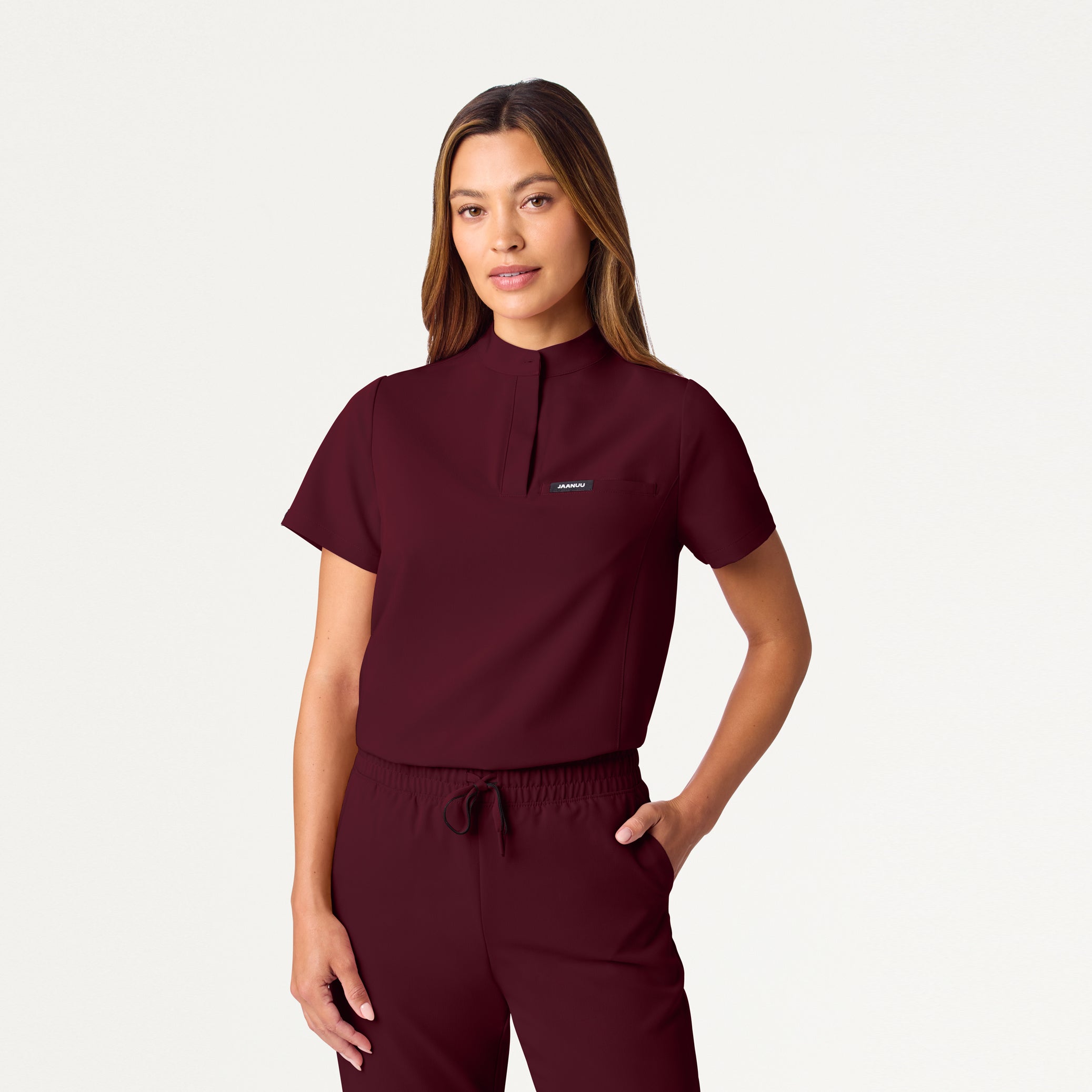 Woman wearing Burgundy scrub top