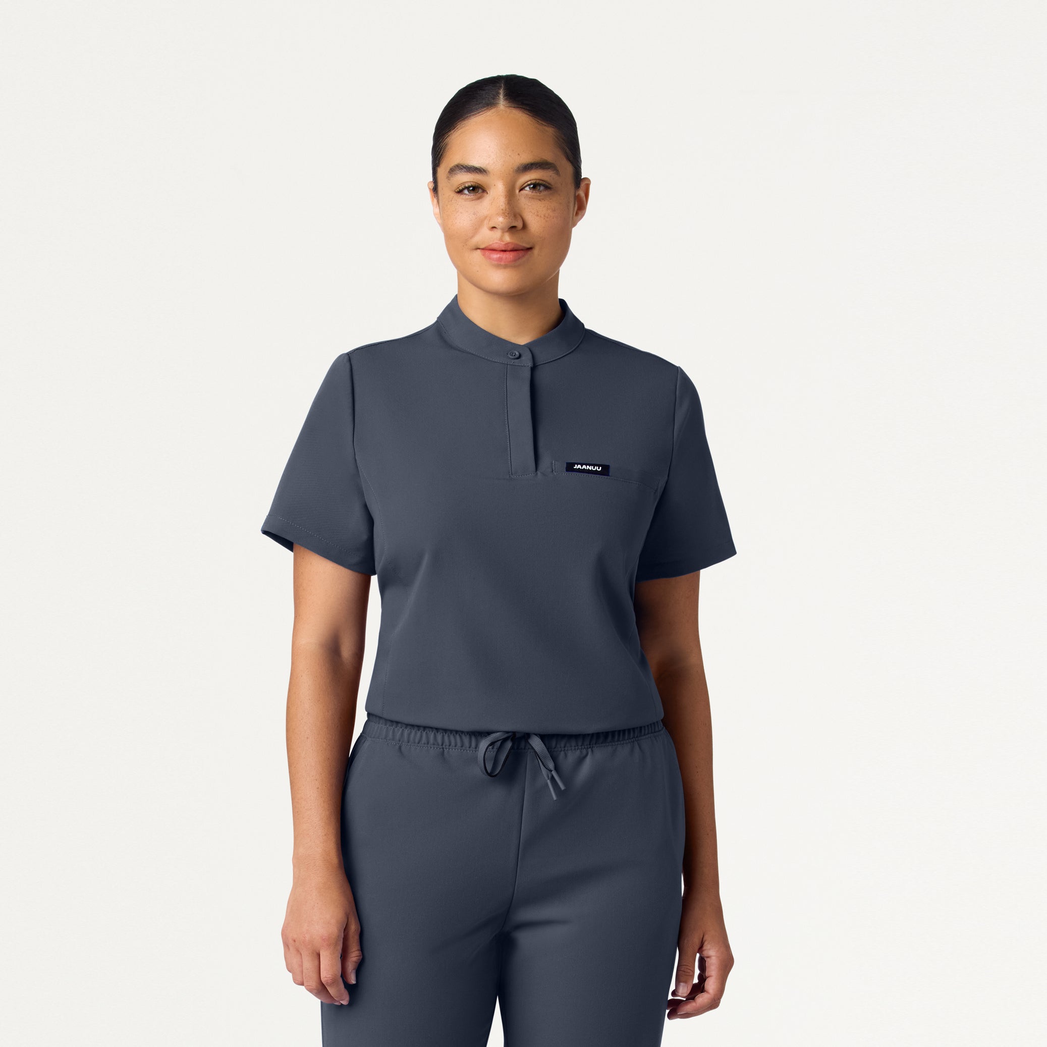 Woman wearing Carbon Gray scrub top