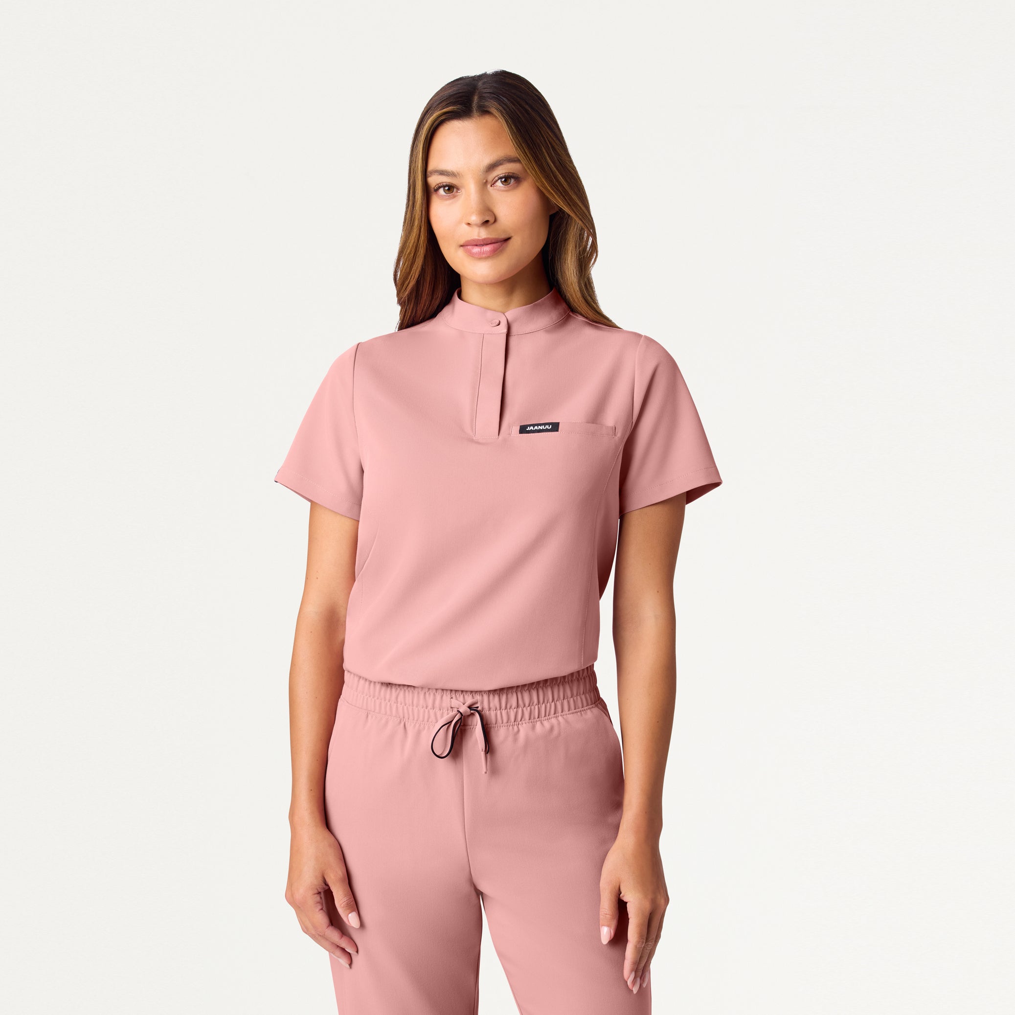 Woman wearing Mauve scrub top