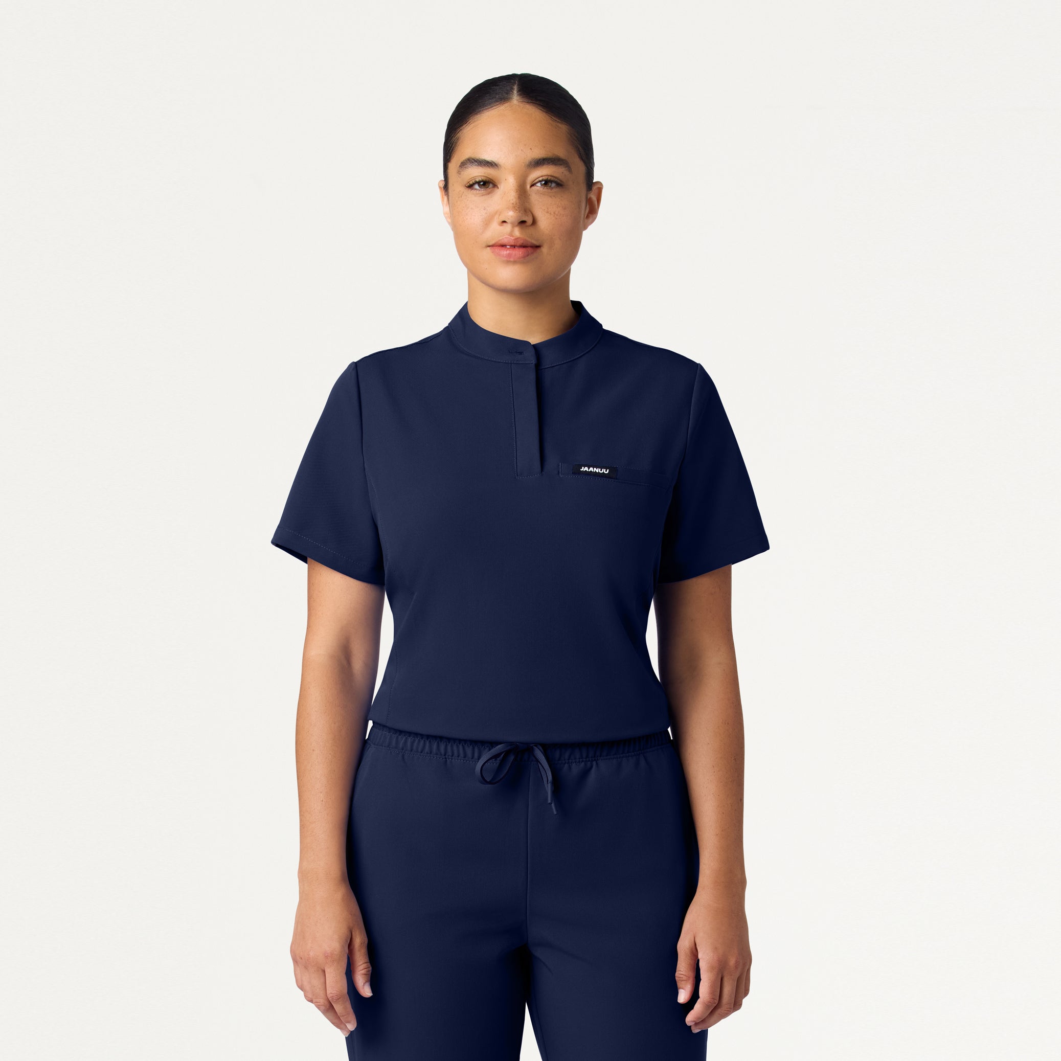 Woman wearing Midnight Navy scrub top