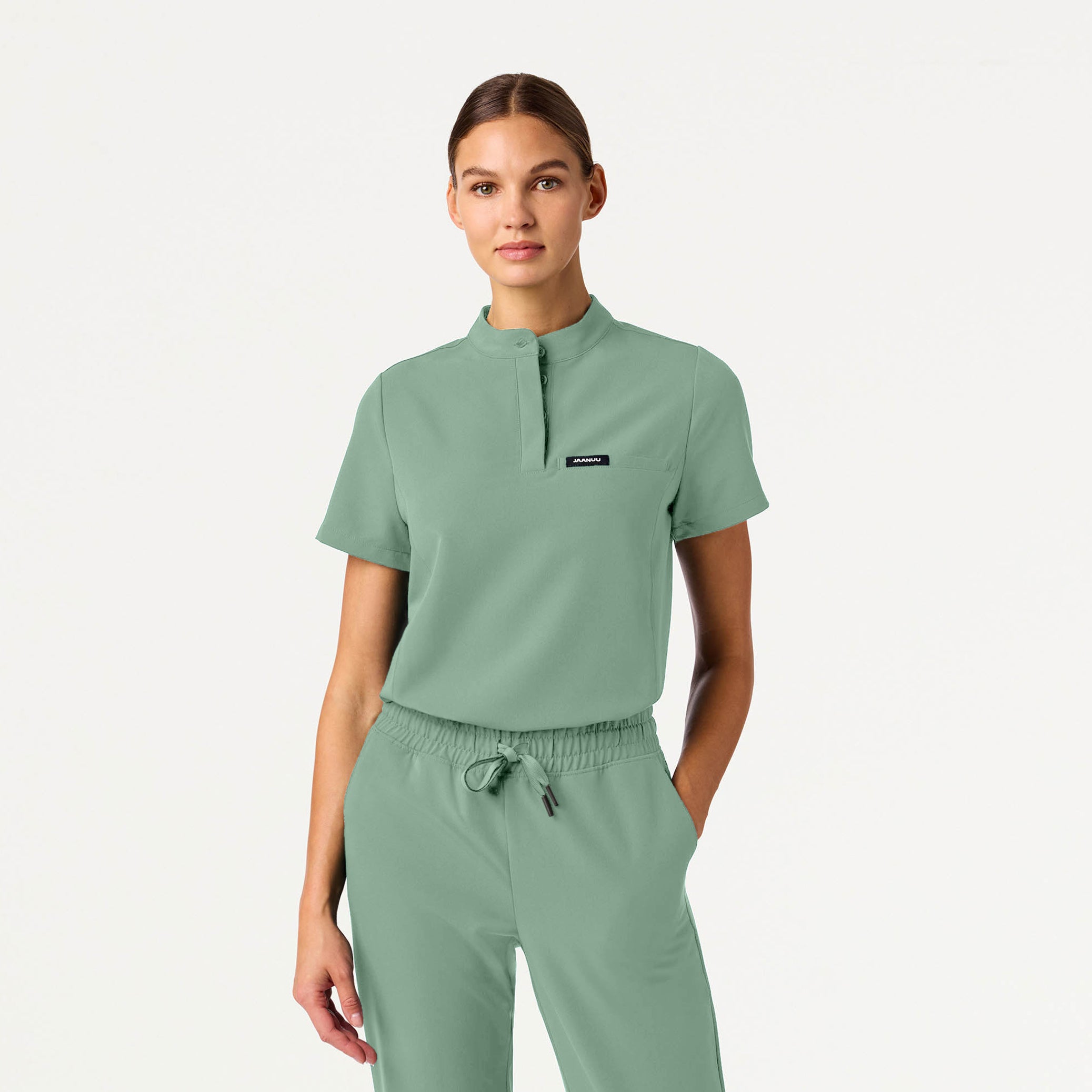 Woman wearing Sage scrub top