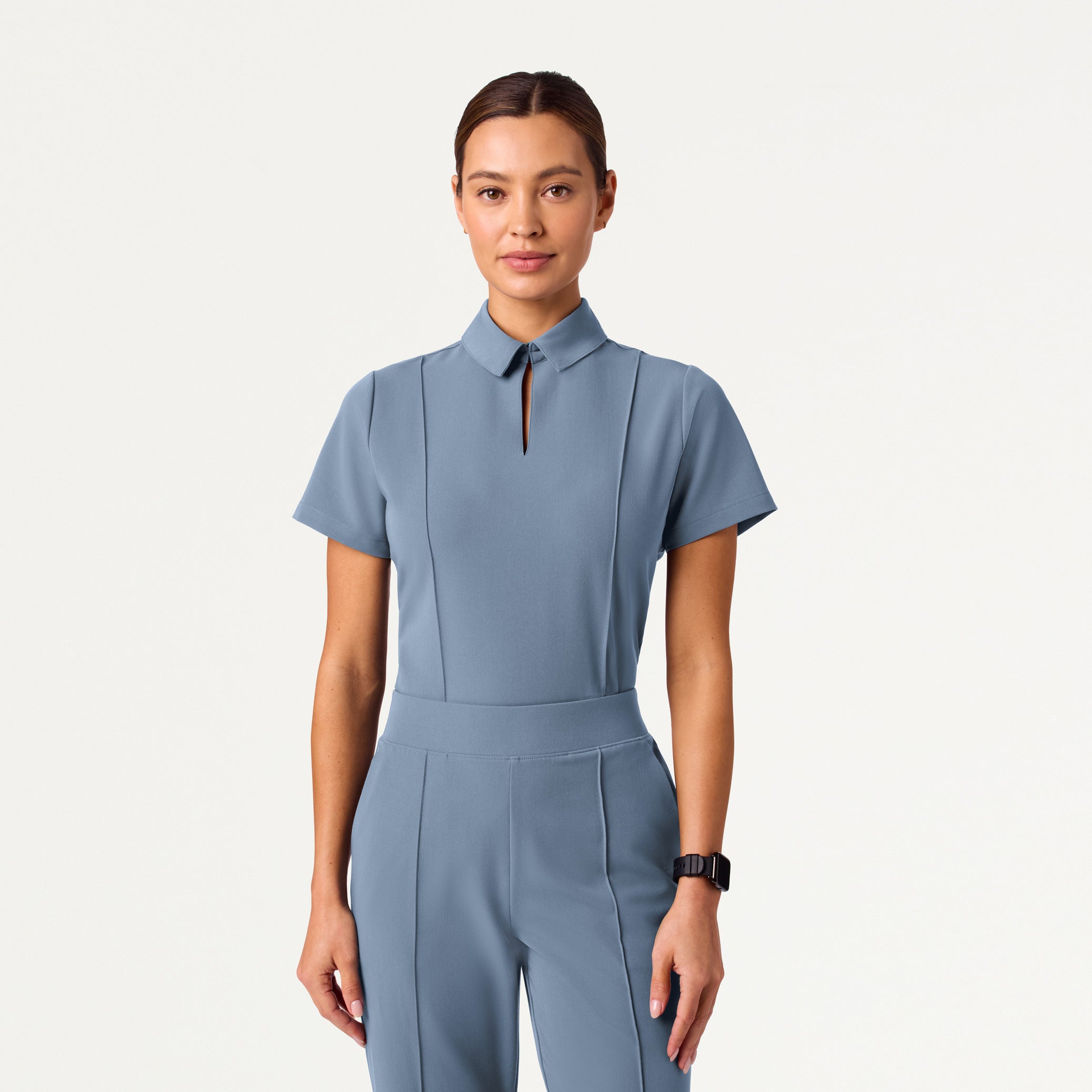 Woman wearing Storm Blue scrub top