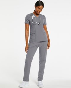 Woman with grey pants and scrubs