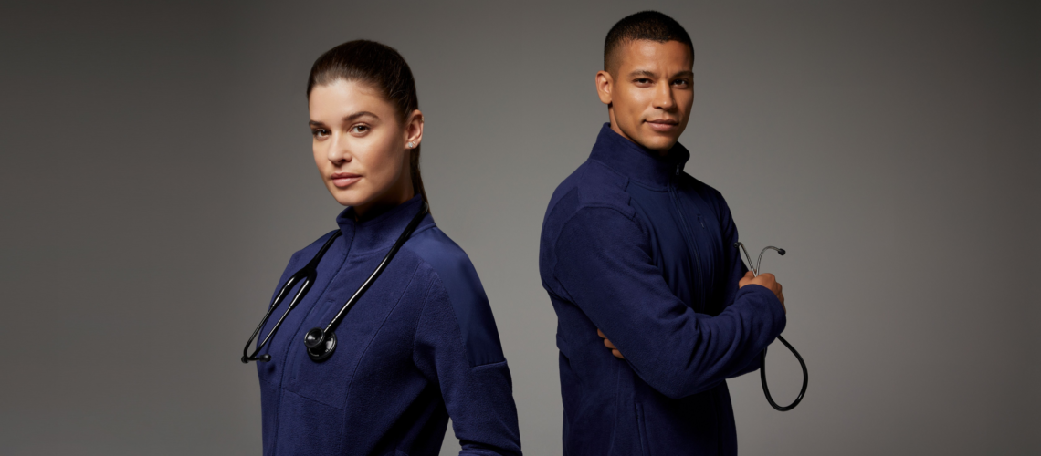 Man and woman with blue navy scrubs