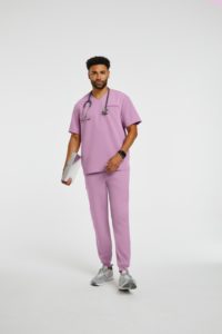 Man wearing pink scrubs