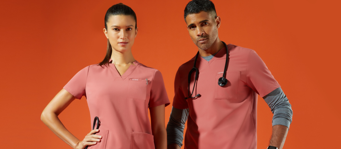 man and woman with color salmon scrubs