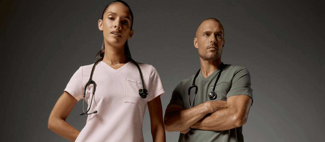 Woman and man wearing pink and olive scrubs