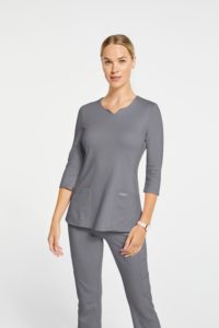 Woman wearing grey scrub top