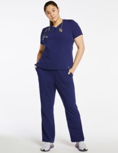 Woman wearing navy blue scrub pant and top