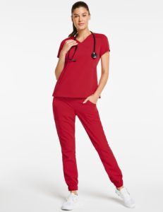 Woman wearing pocket jogger pant scrubs in red