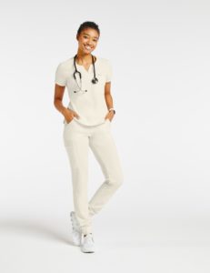 Woman wearing pocket tuck in top scrubs