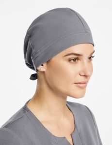 Woman wearing scrub cap in gray