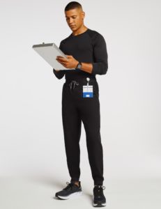 man holding notepad and wearing jogger in black