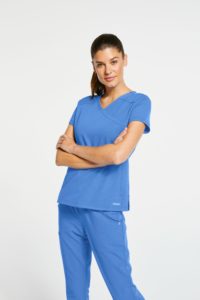 woman wearing light blue scrubs