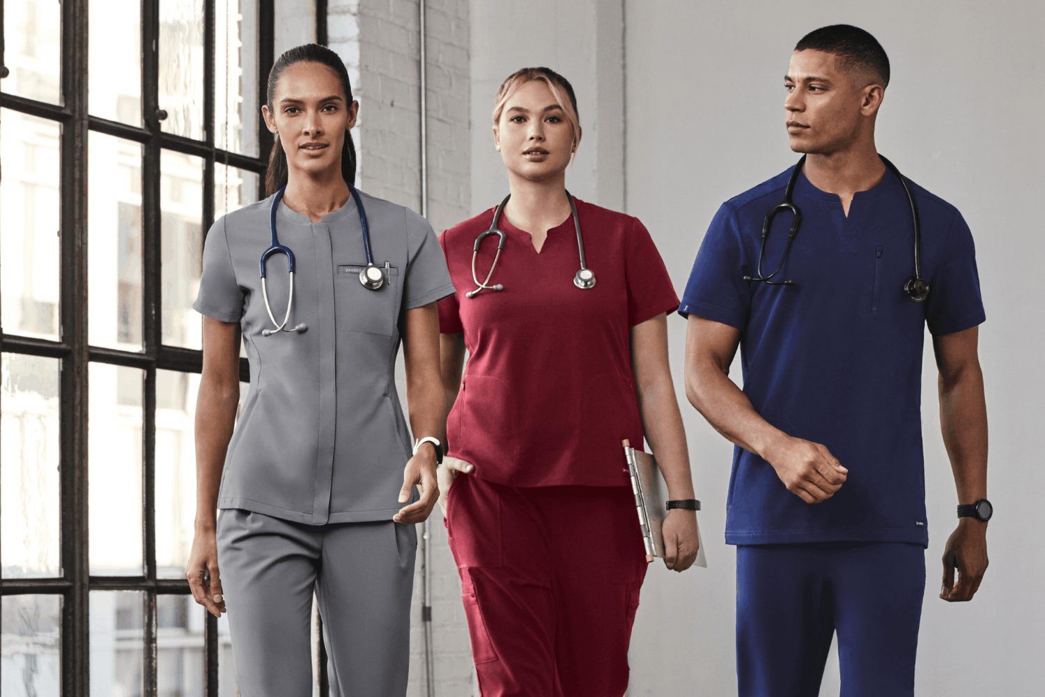 women and men wearing scrubs and stethoscopes
