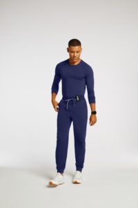 Man-wearing-trim-cuff-jogger-pant-scrubs-in-navy