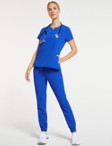 Woman wearing 3-pocket notched top scrubs in royal blue