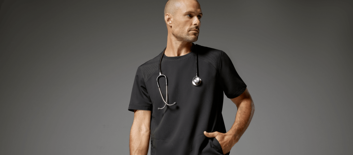 Man-wearing-raglan-sleeve-top-scrubs-in-black