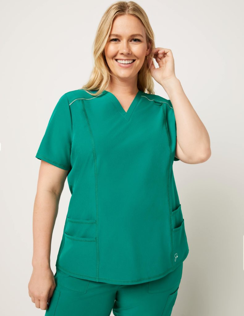 Woman wearing shift v neck top green scrubs