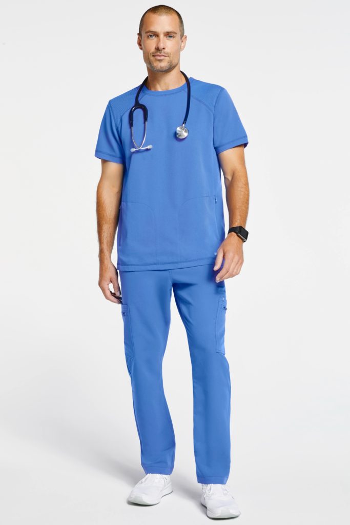 neurologist wearing two piece blue scrubs