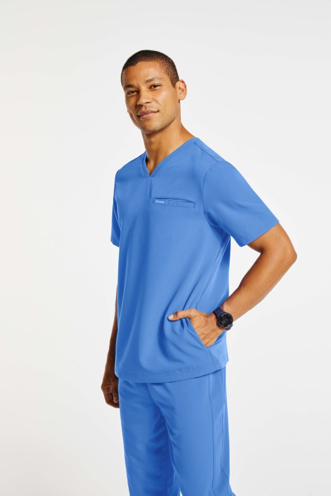 nurse wearing jaanuu blue pocket v neck