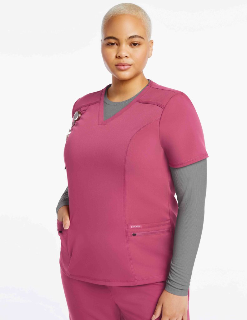 nurse wearing pink pocket scrubs