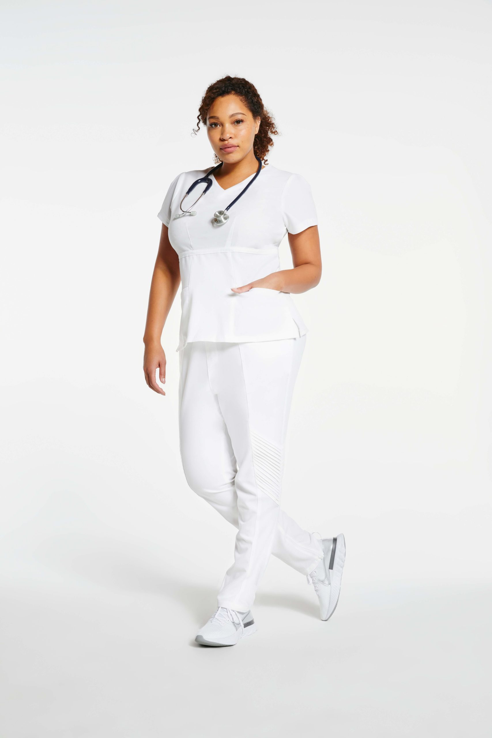 nurse wearing white moto pants