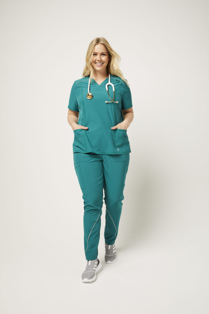 Nurse wearing charge cargo drawcord green pant scrubs